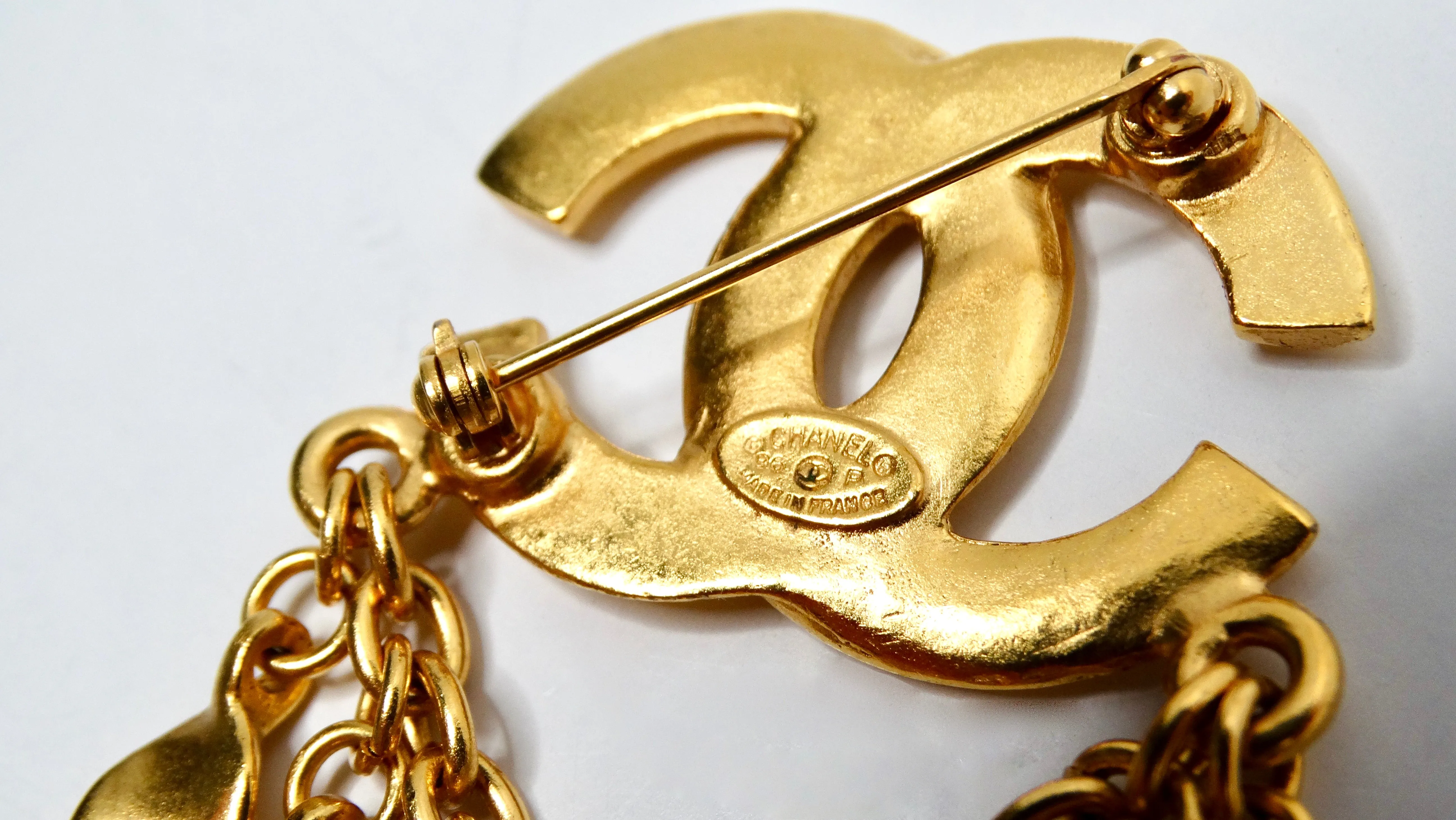 1996 Chanel Coco Mark Yellow Gold-Tone Brooch With Dangling Charms