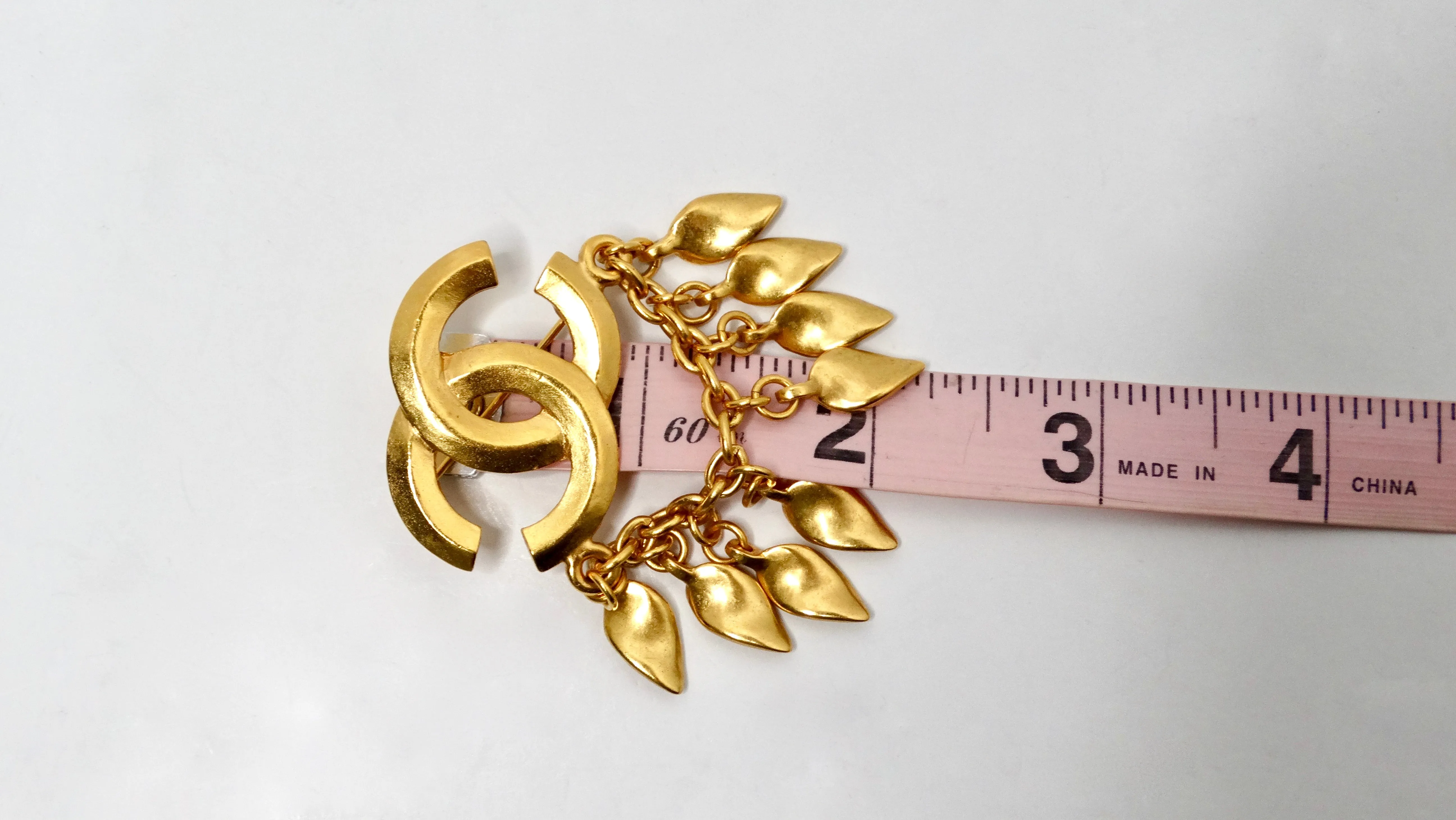 1996 Chanel Coco Mark Yellow Gold-Tone Brooch With Dangling Charms