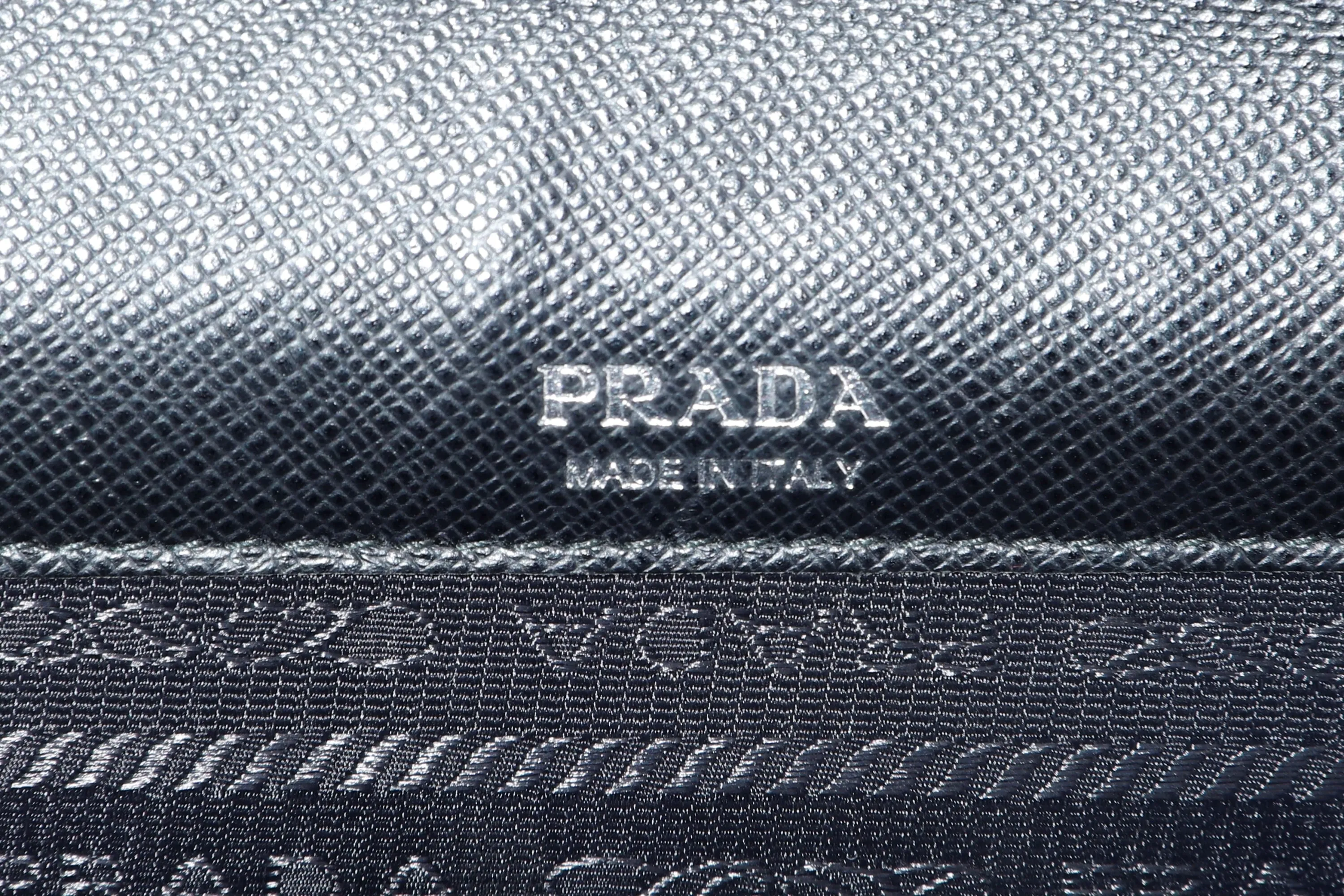 PRADA CLUTCH BLACK RETRO RACING LOGO PRINT SAFFIANO LEATHER SILVER HARDWARE, NO CARD & DUST COVER