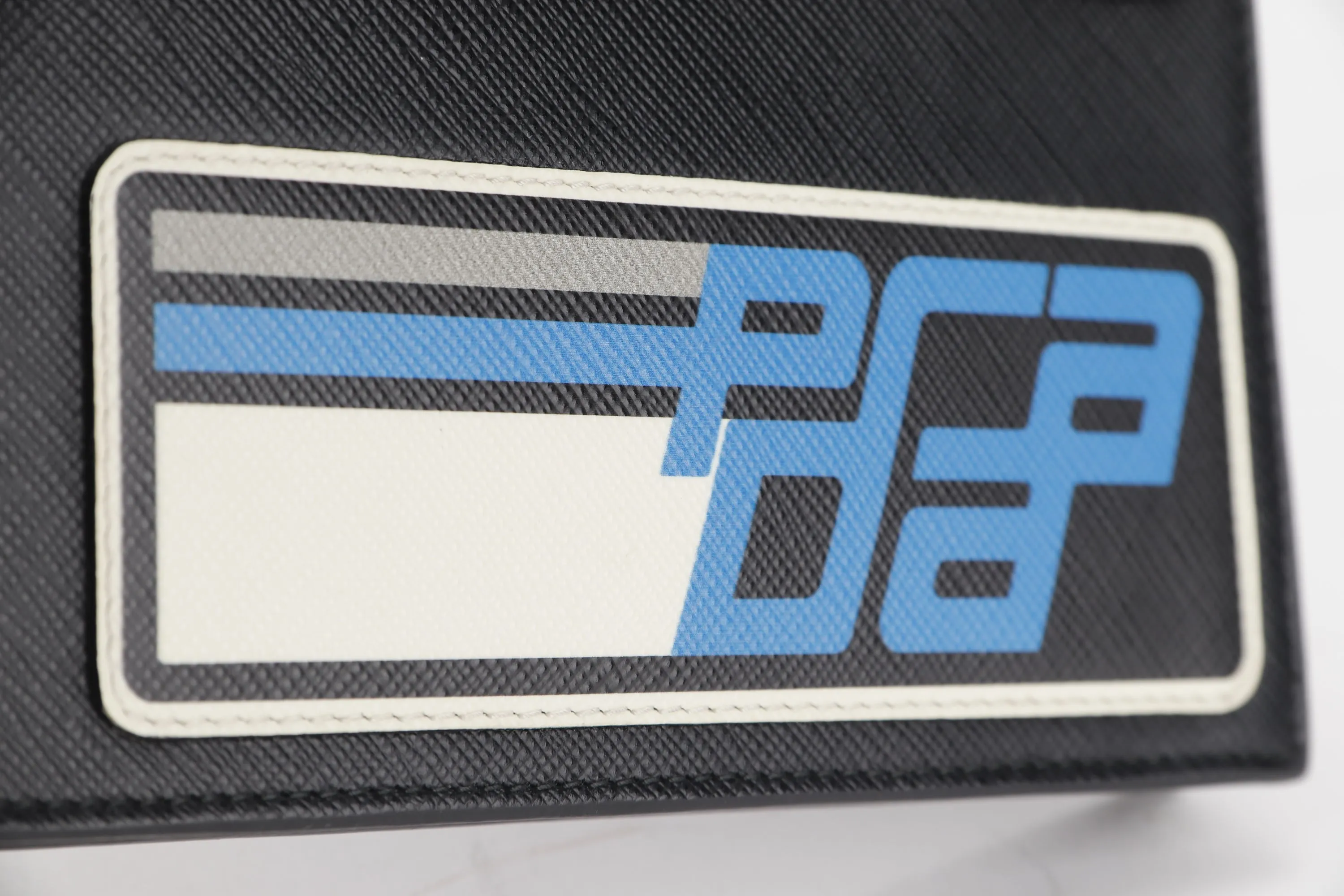 PRADA CLUTCH BLACK RETRO RACING LOGO PRINT SAFFIANO LEATHER SILVER HARDWARE, NO CARD & DUST COVER