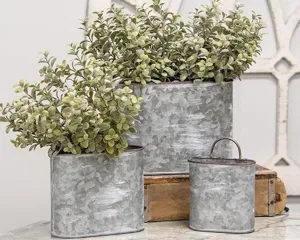 Set of galvanized metal oval planters